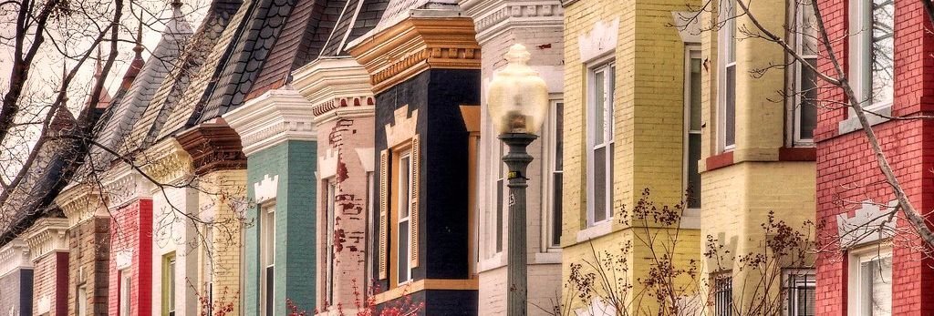  row of colorful Victorian-style row houses