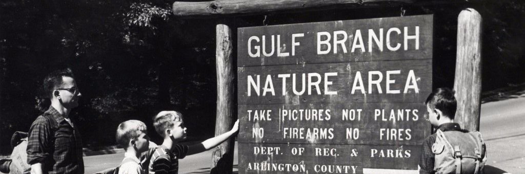 family at the entrance of the Gulf Branch Nature Area
