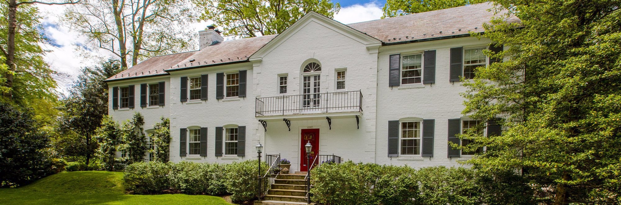 white brick Colonial-style house located in the Spring Valley neighborhood of Washington, D.C.